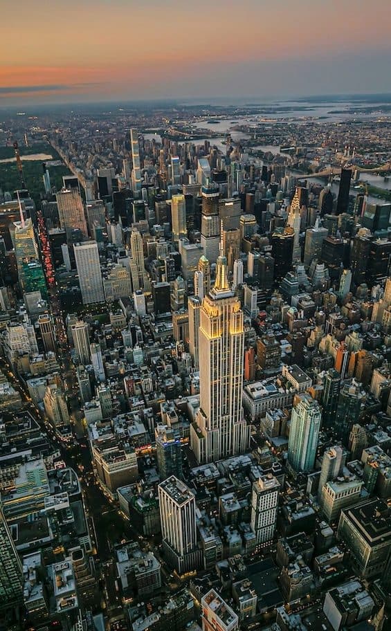Aerial view of a dense city at dusk