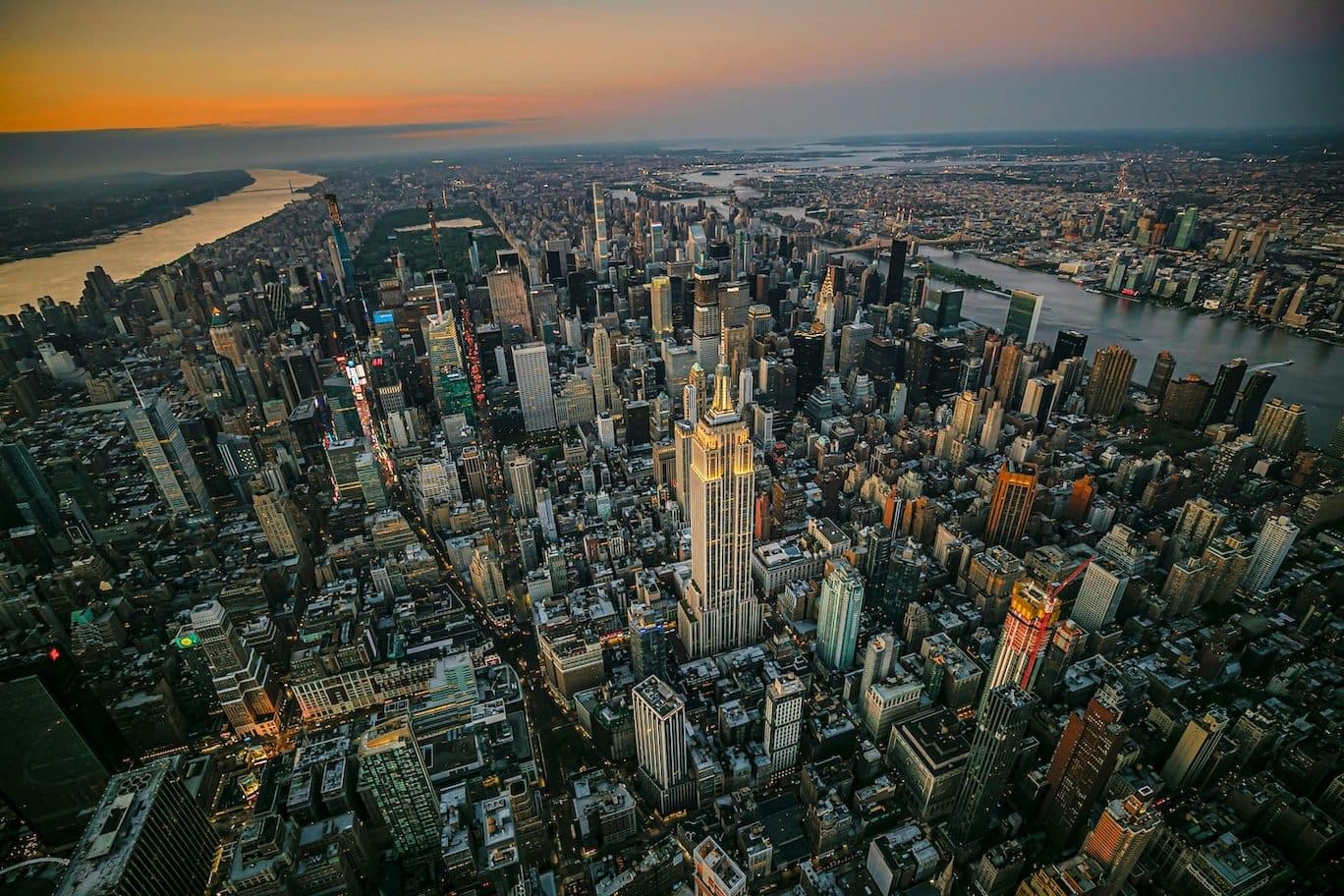 Aerial view of a dense city at dusk